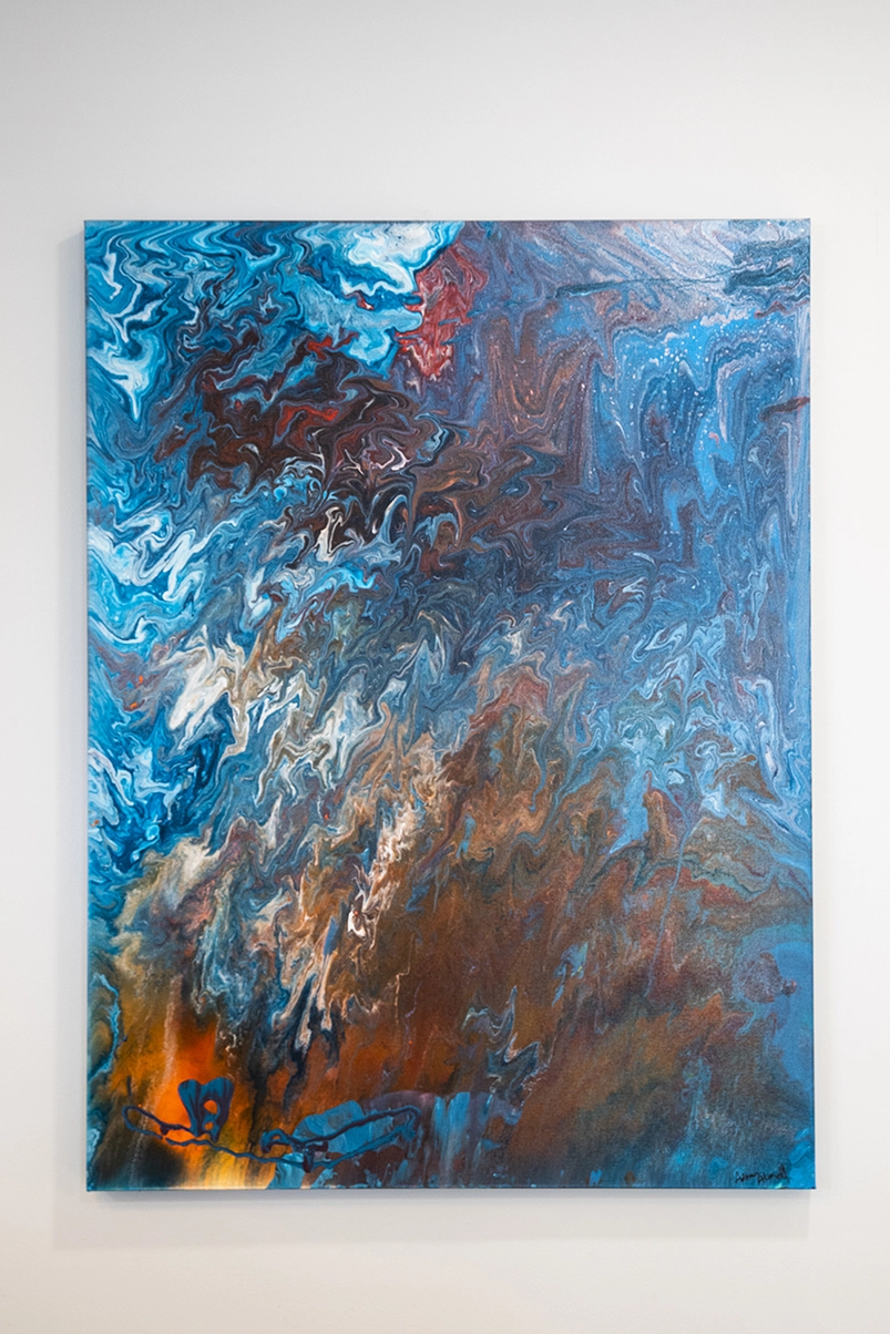 Abstract art piece primarily featuring the colors blue, red, and orange