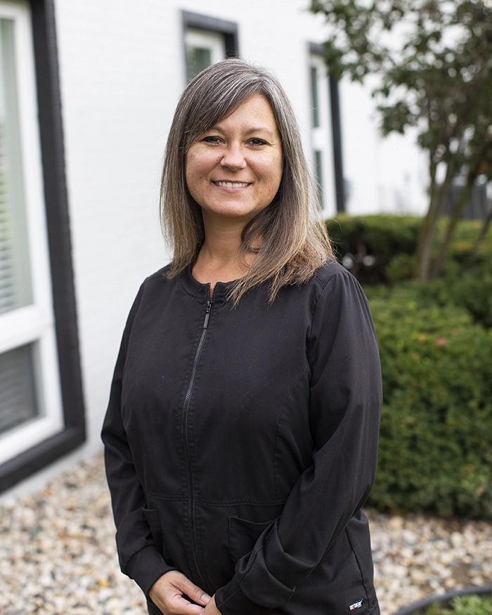 Portrait of Myranda, Dental Hygienist from the waist up. Woman in hygienist uniform.